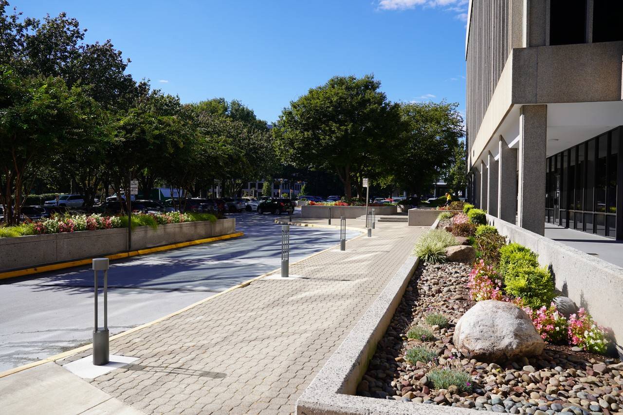The sidewalk outside the building
