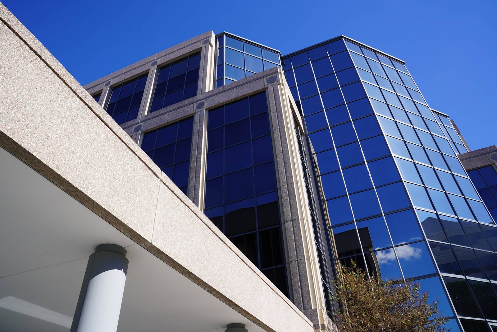 The glass office tower at 8100 Boone Blvd